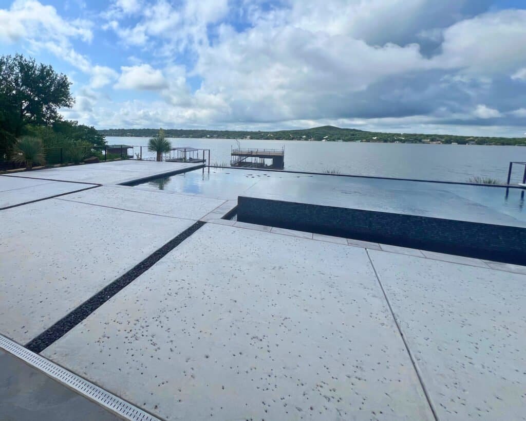Beachfront pool with sleek modern finish and textured surround.